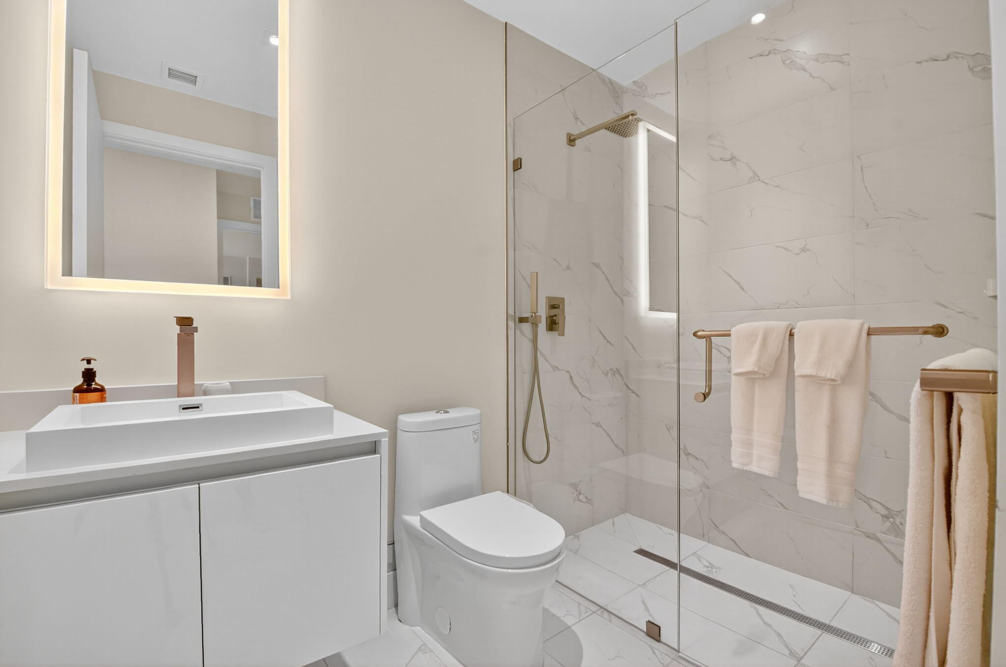 3100 North Ocean Drive, Unit 1210H Singer Island, FL 33404 - Photo 37 of 93 a bathroom with a sink toilet and shower