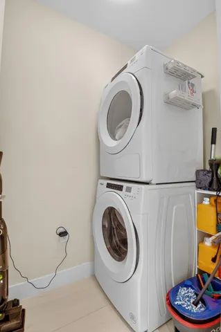 a large living room with lots of furniture and a large window