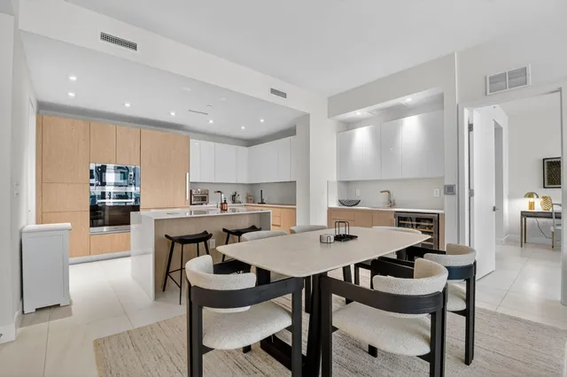 a kitchen with stainless steel appliances granite countertop a sink and cabinets