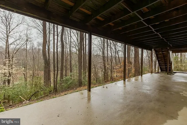 a view of an empty room with wooden walls