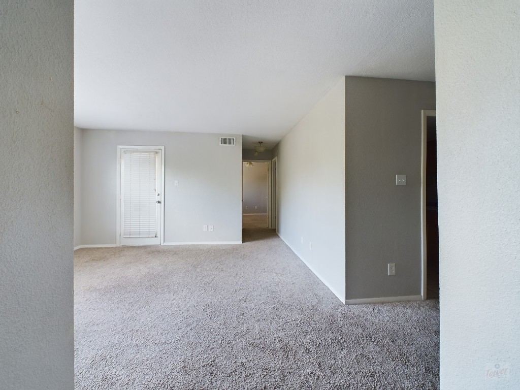a view of an empty room and closet