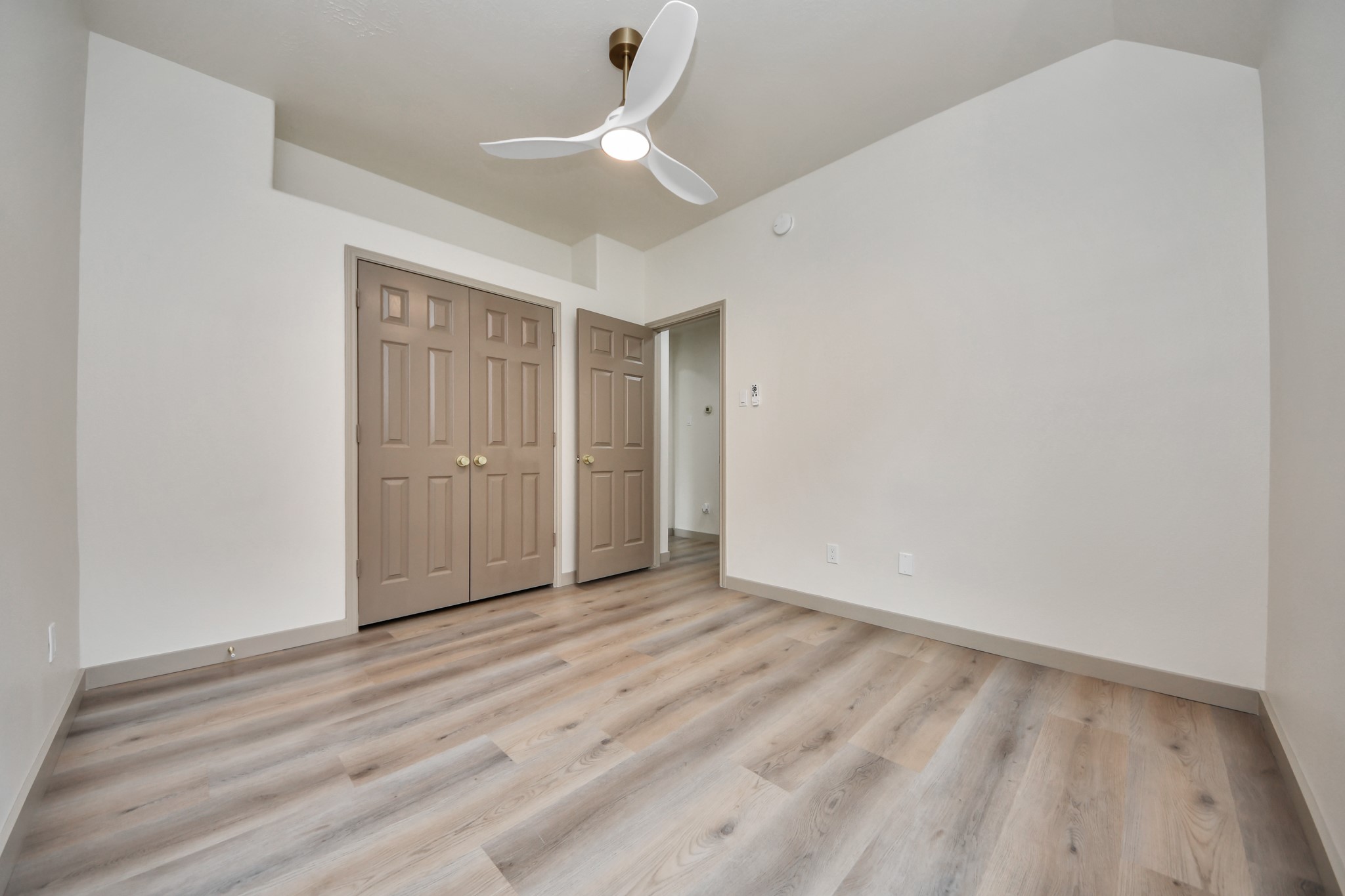 14423 Gadwall Court Houston, TX 77044 - Photo 14 of 42 a view of an empty room with wooden floor