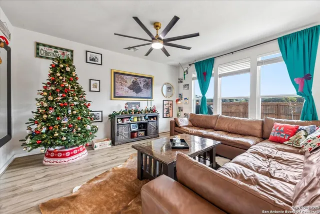 a living room with furniture and a large window