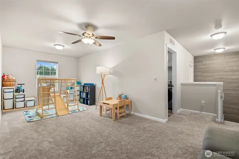 a livingroom with furniture and ceiling fan