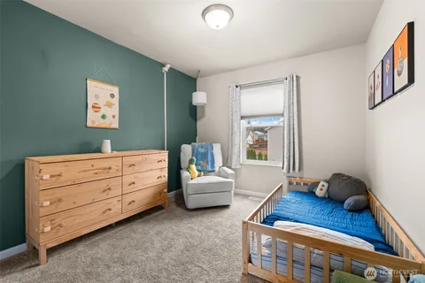 a bedroom with furniture and a window