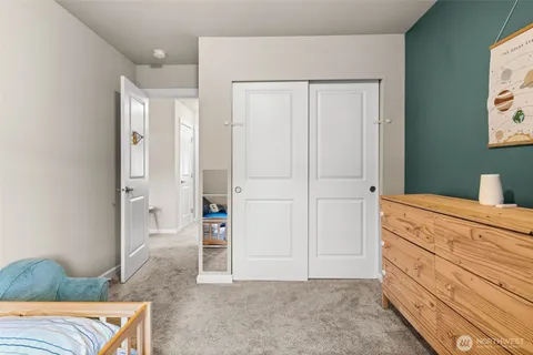 a room with a bed and a view of bathroom