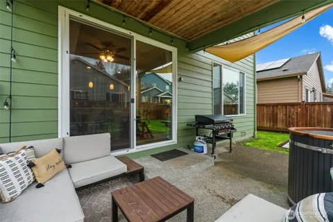 a backyard of a house with outdoor seating