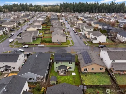an aerial view of a house with a garden