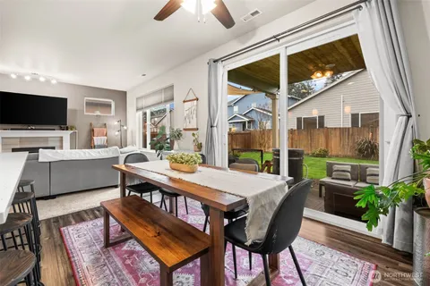 a view of a livingroom with furniture and a flat screen tv