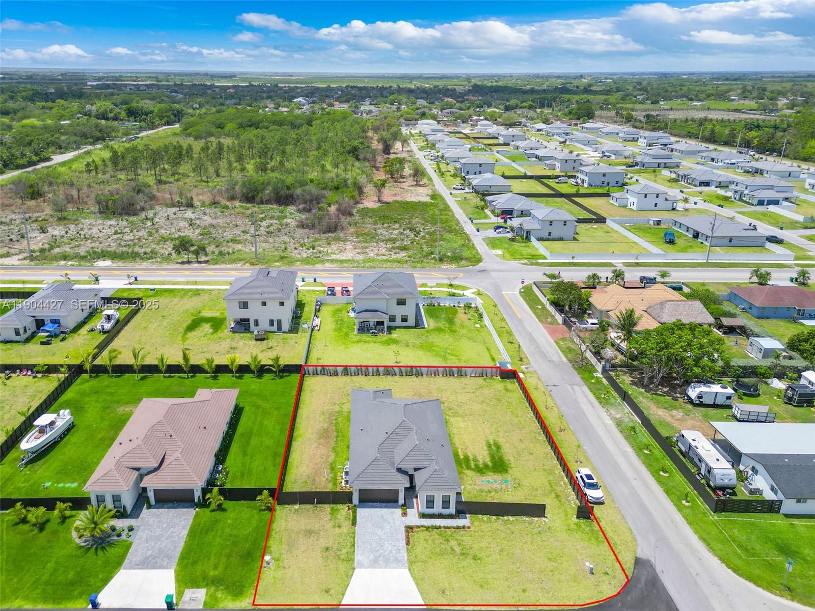 32206 Southwest 196th Avenue, Unit 1 Homestead, FL 33030 - Photo 8 of 8 an aerial view of residential houses with outdoor space and swimming pool