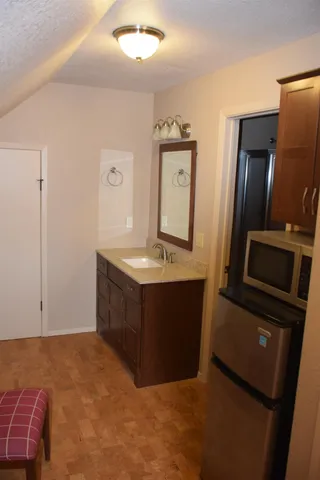 a spacious bathroom with a sink and a mirror