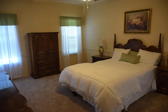 a bedroom with a bed and a walk in closet