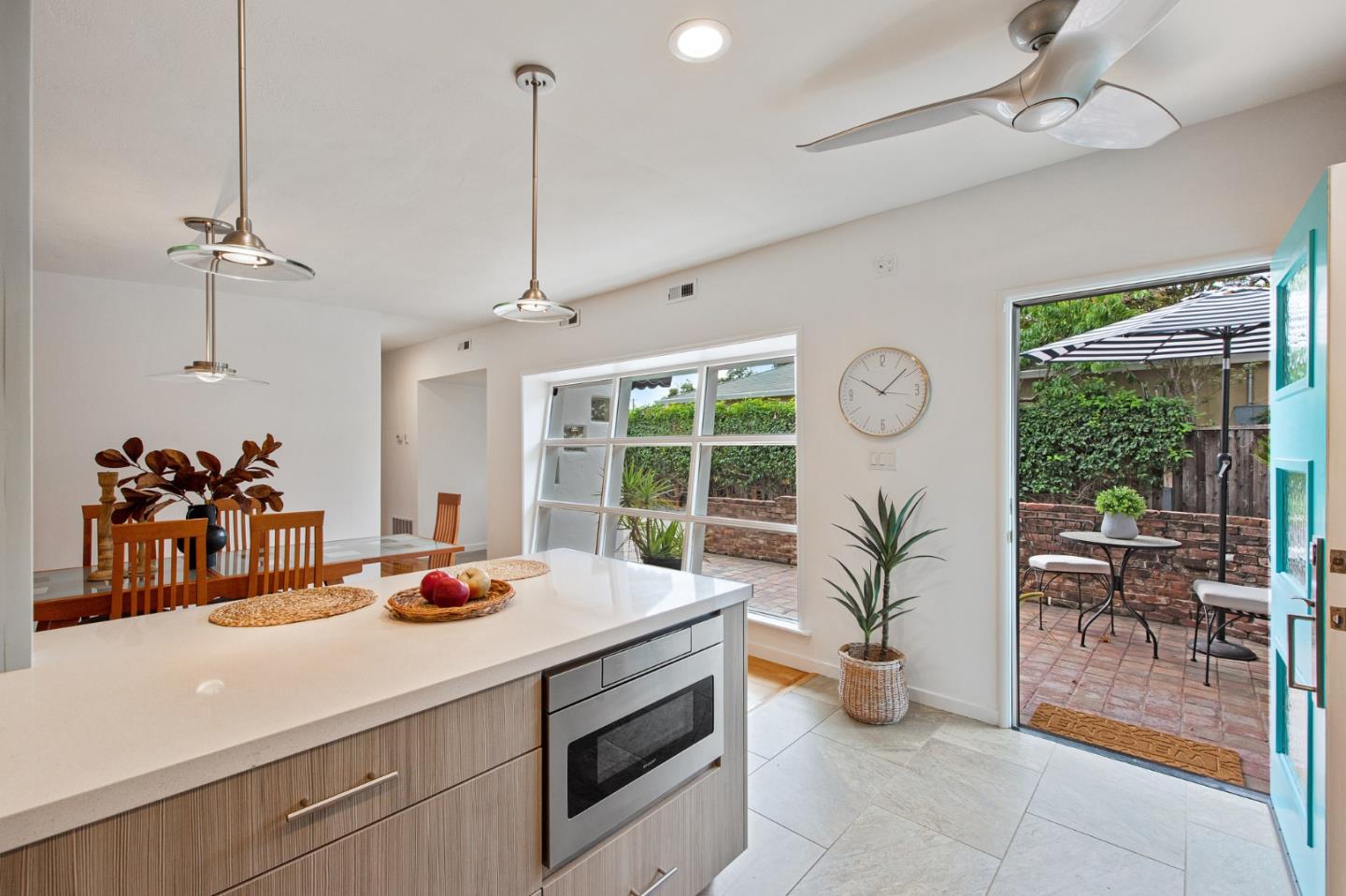 222 North 3rd Street Campbell, CA 95008 - Photo 11 of 35 a kitchen with a stove a faucet a chandelier and living room view