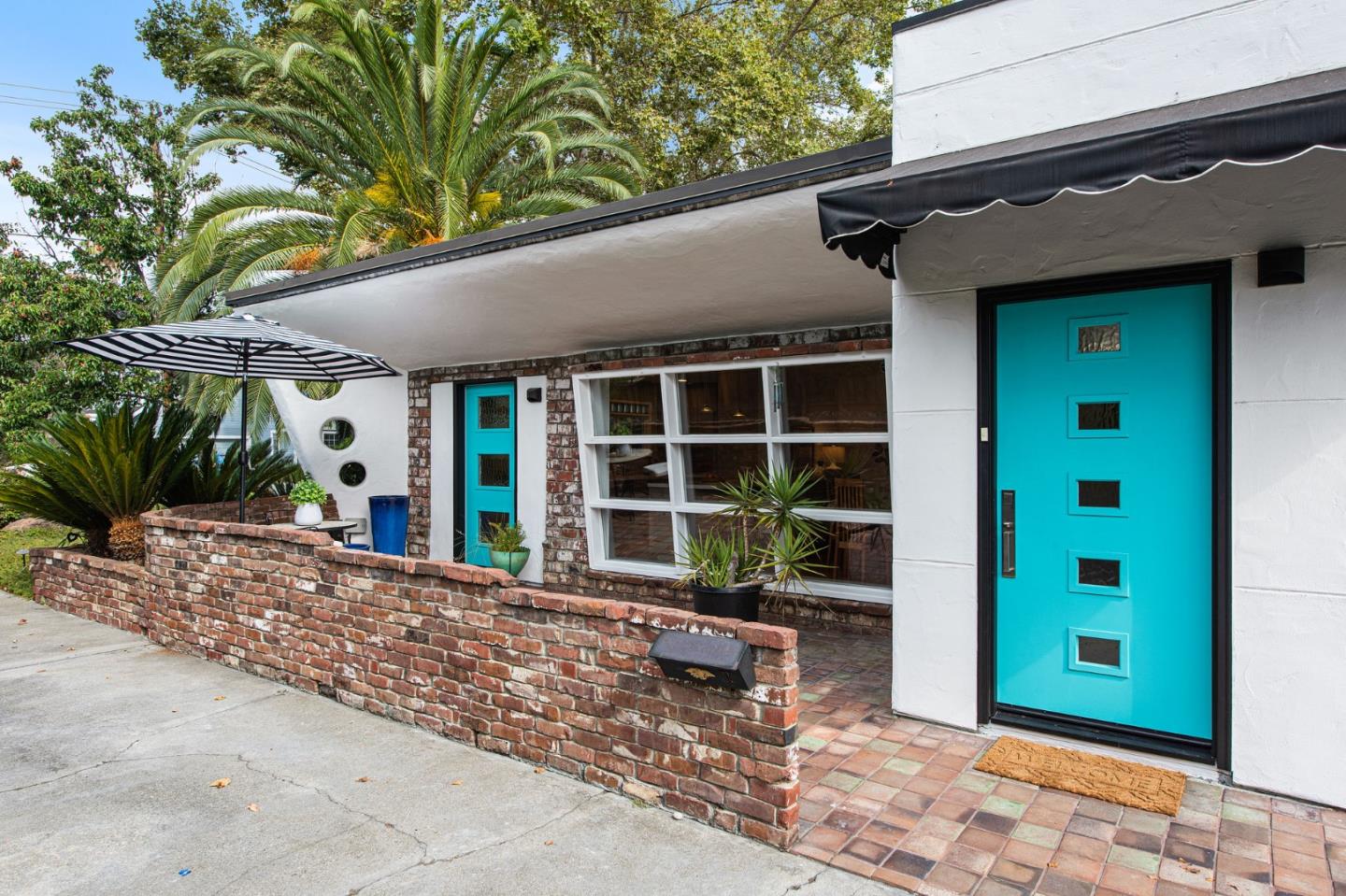 222 North 3rd Street Campbell, CA 95008 - Photo 2 of 35 a front view of a house with a yard and potted plants