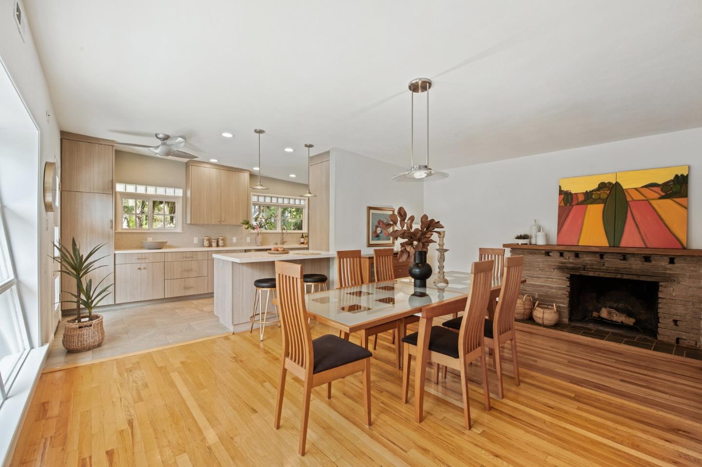 222 North 3rd Street Campbell, CA 95008 - Photo 4 of 35 a view of a dining room with furniture wooden floor and a fireplace