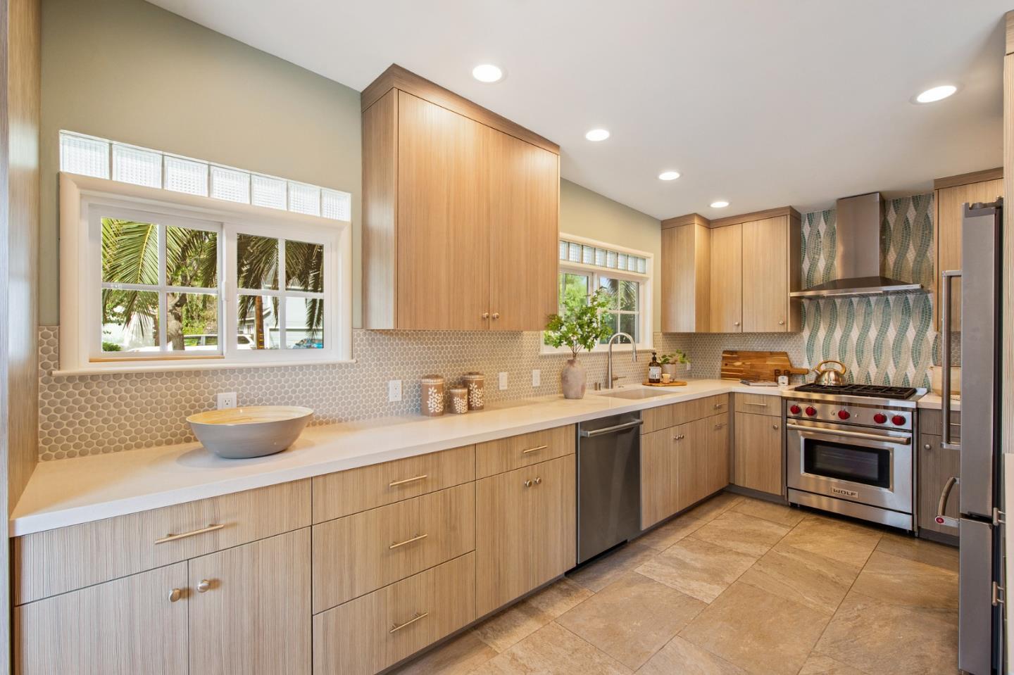 222 North 3rd Street Campbell, CA 95008 - Photo 6 of 35 a kitchen with a sink stove and cabinets