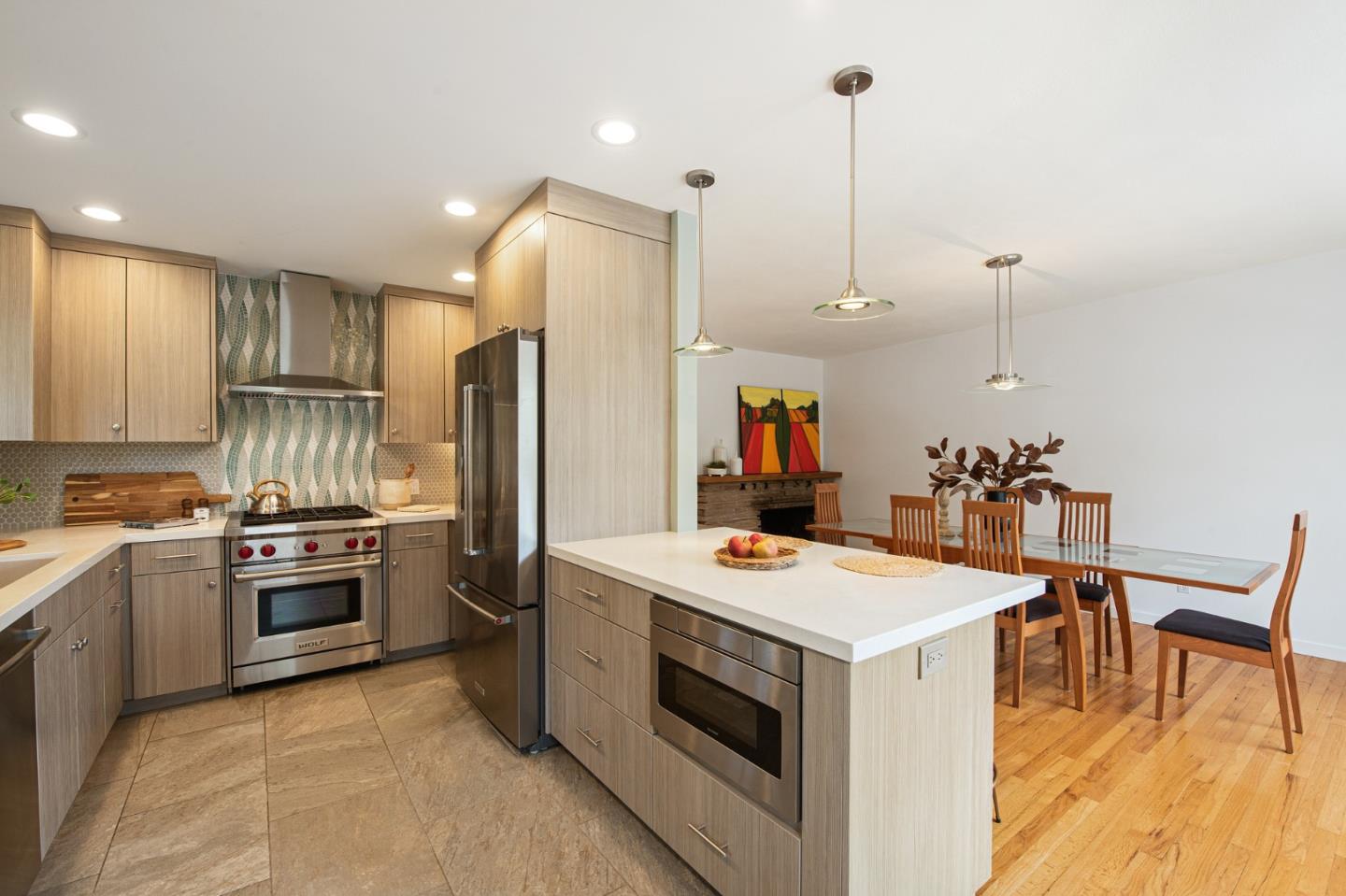 222 North 3rd Street Campbell, CA 95008 - Photo 7 of 35 a kitchen that has a stove a table and chairs in it