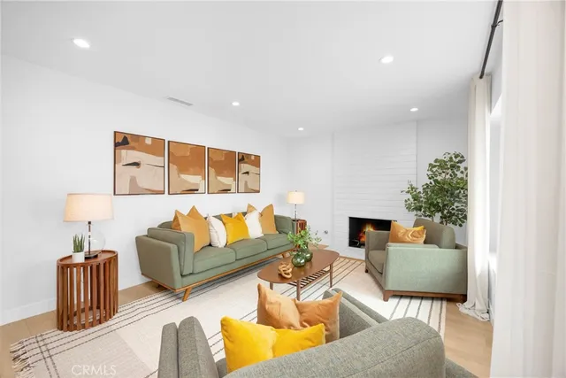 a living room with furniture and a lamp