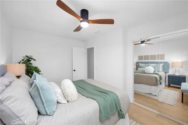 a bedroom with a bed and a couch