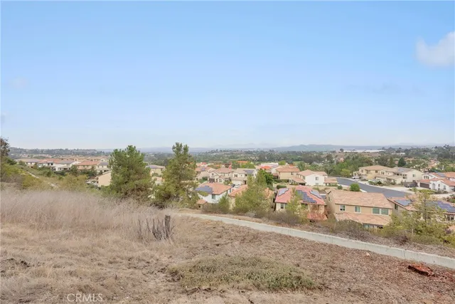 an empty room with a ceiling fan and window