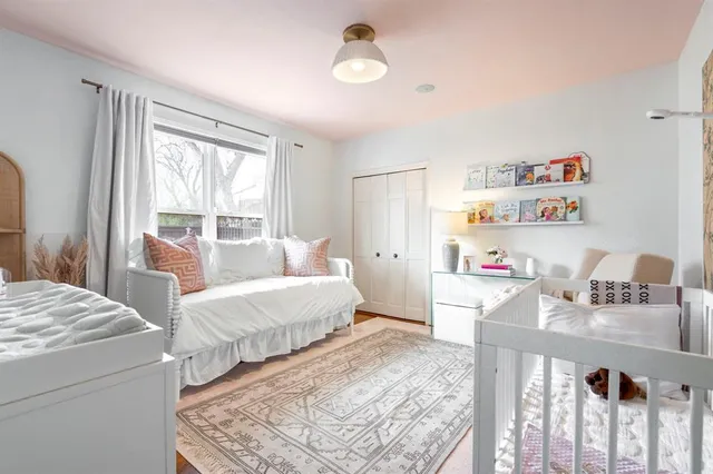 a bedroom with furniture and a window