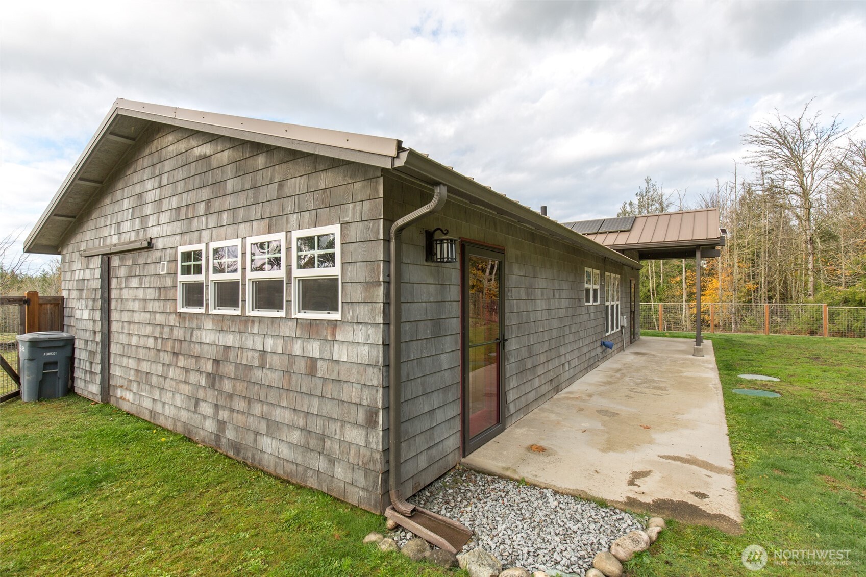 1083 Blyn Springs Road Sequim, WA 98382 - Photo 13 of 40 a front view of a house with garden