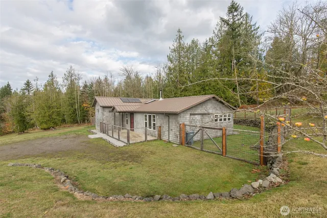 a view of a house with large windows