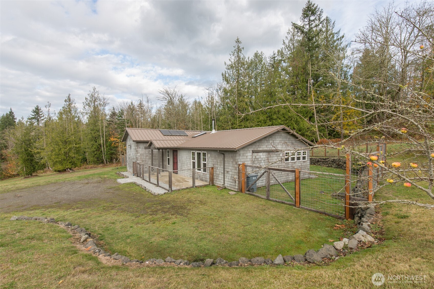 1083 Blyn Springs Road Sequim, WA 98382 - Photo 15 of 40 a view of house with outdoor space and garden