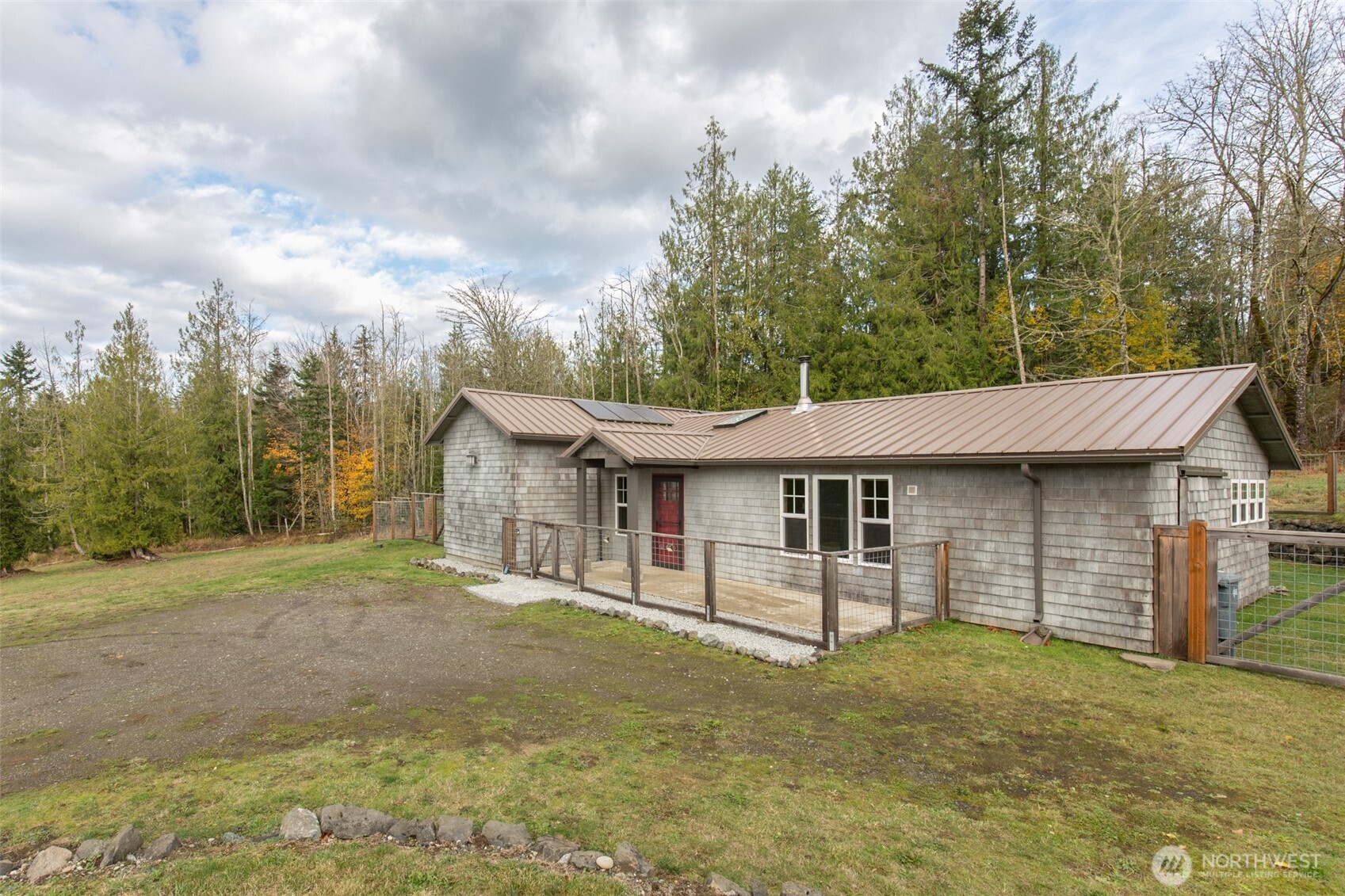1083 Blyn Springs Road Sequim, WA 98382 - Photo 16 of 40 a view of a house with backyard and trees