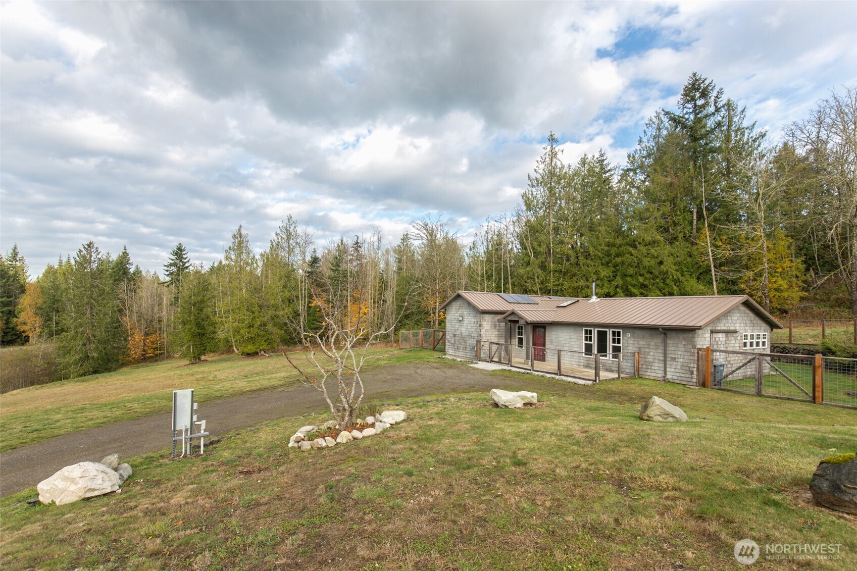 1083 Blyn Springs Road Sequim, WA 98382 - Photo 17 of 40 a view of a house with a big yard