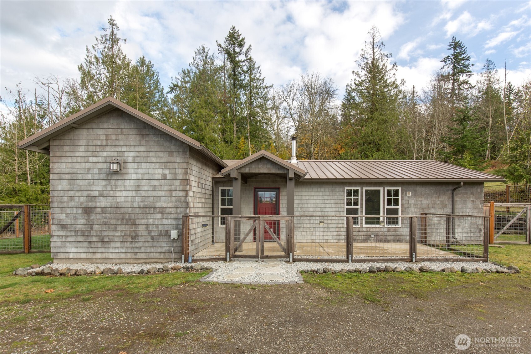 1083 Blyn Springs Road Sequim, WA 98382 - Photo 20 of 40 a view of a house with a yard
