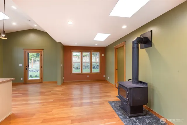 a kitchen with a stove and a window