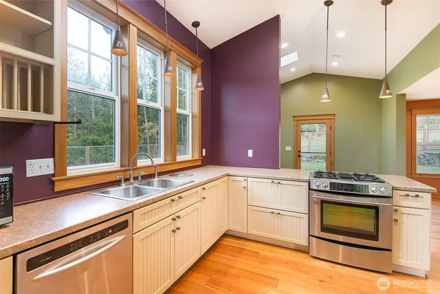 a view of a bathroom with a tub and shower