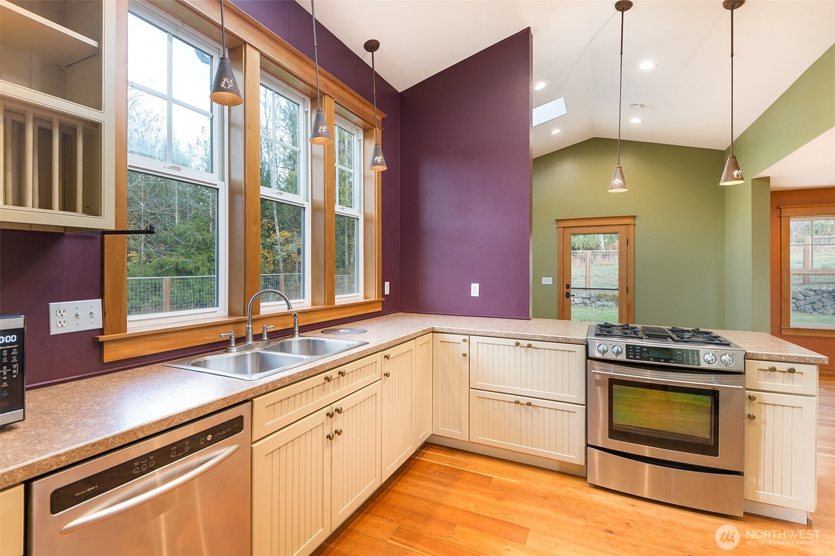 1083 Blyn Springs Road Sequim, WA 98382 - Photo 27 of 40 a kitchen with a sink stove and cabinets