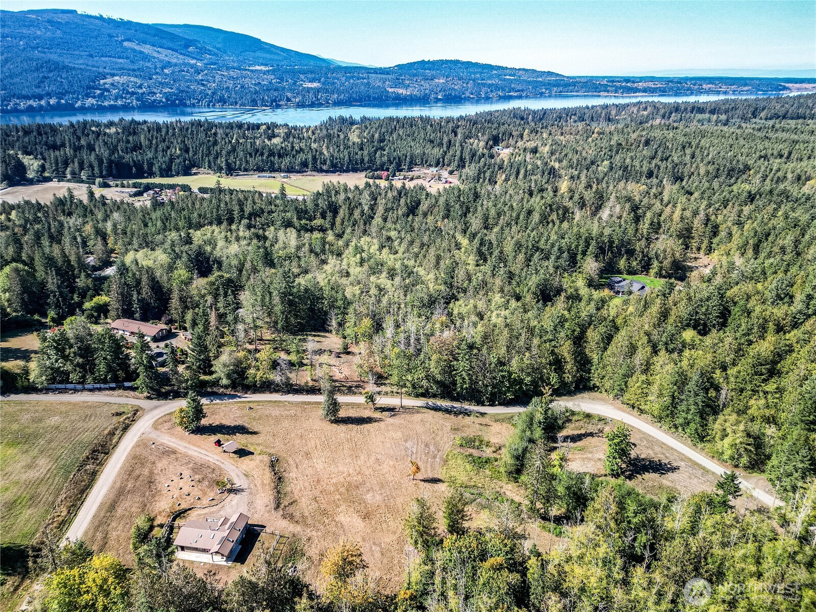 1083 Blyn Springs Road Sequim, WA 98382 - Photo 4 of 40 a view of a house with a yard and a lake view