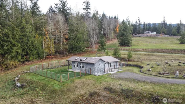 a view of a house with a yard from a balcony