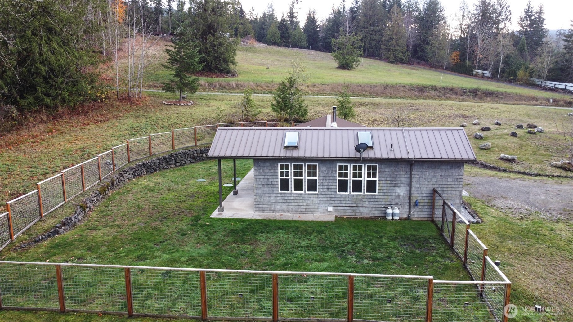 1083 Blyn Springs Road Sequim, WA 98382 - Photo 9 of 40 a view of a house with a yard from a balcony
