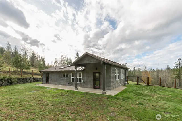 a view of house with outdoor space and garden
