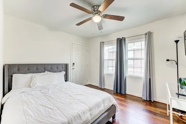 a view of living room with furniture and wooden floor