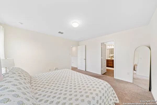 a bedroom with a bed and a closet