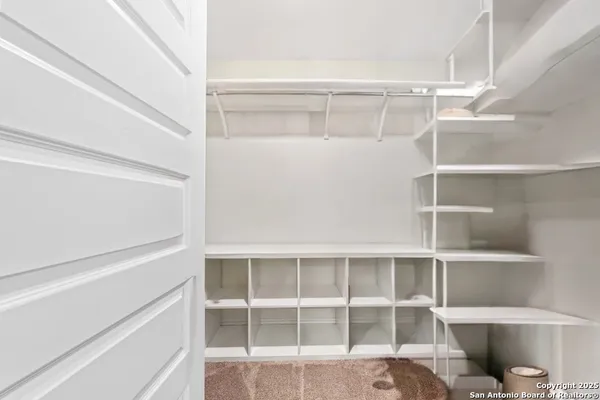 a view of an empty walk in closet