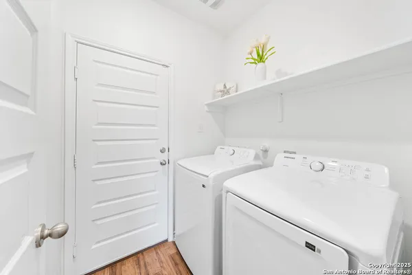 a utility room with dryer and washer