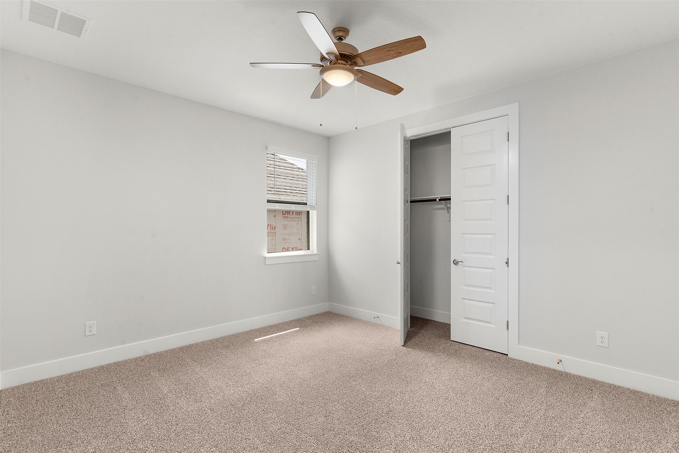 1129 Pansy Trail Georgetown, TX 78628 - Photo 9 of 29 Neutral tone walls with white trim and carpeted flooring