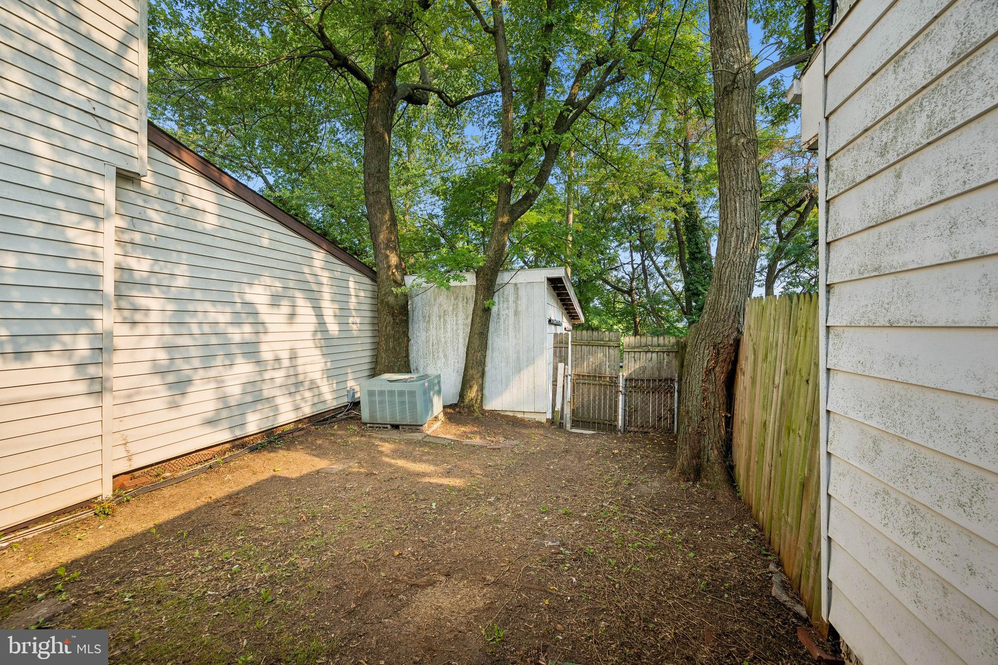 7227 Sindall Road Baltimore, MD 21234 - Photo 48 of 62 a view of a house with a backyard and a tree
