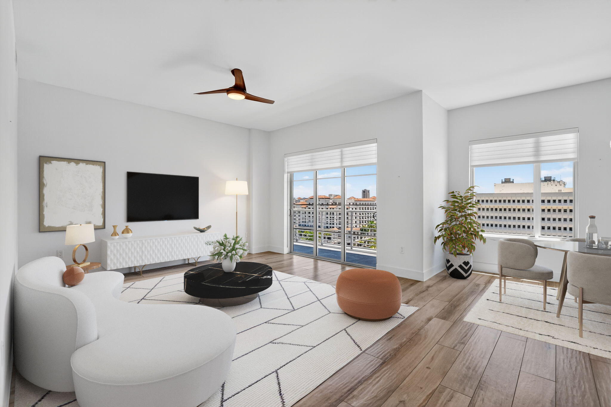 a living room with furniture a flat screen tv and a large window