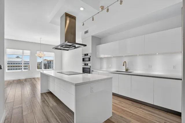 a bath room with a sink and mirror