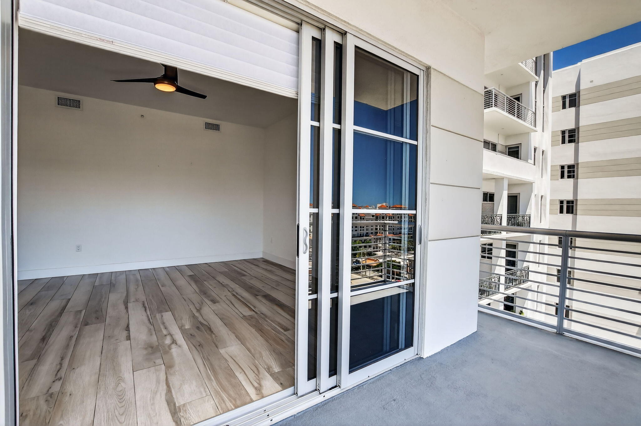 155 East Boca Raton Road, Unit 1014 Boca Raton, FL 33432 - Photo 21 of 62 walk in closet with wooden floor