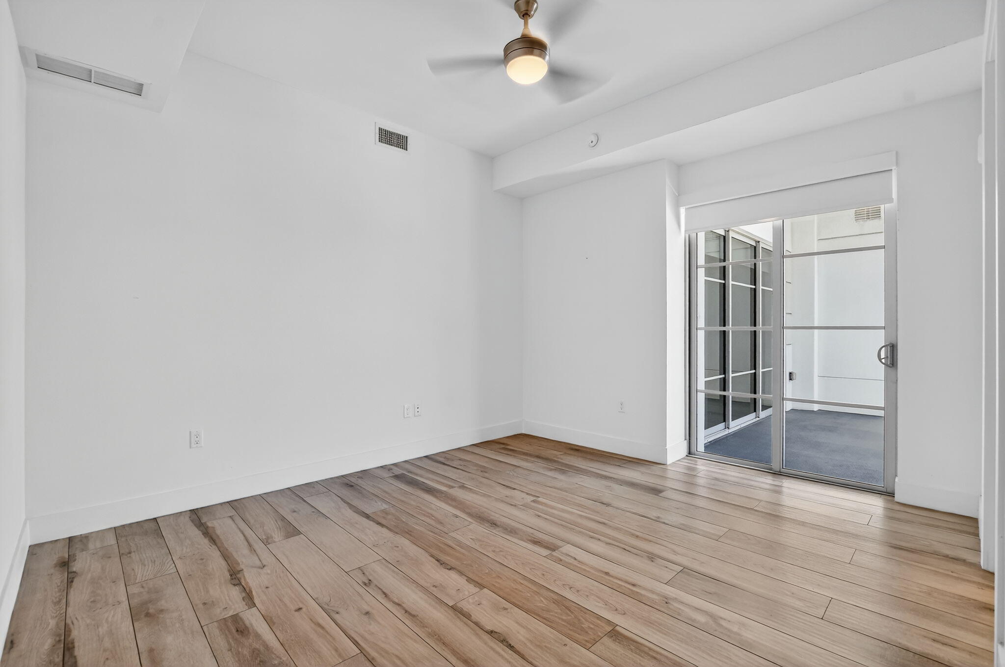 155 East Boca Raton Road, Unit 1014 Boca Raton, FL 33432 - Photo 24 of 62 wooden floor in an empty room with a window