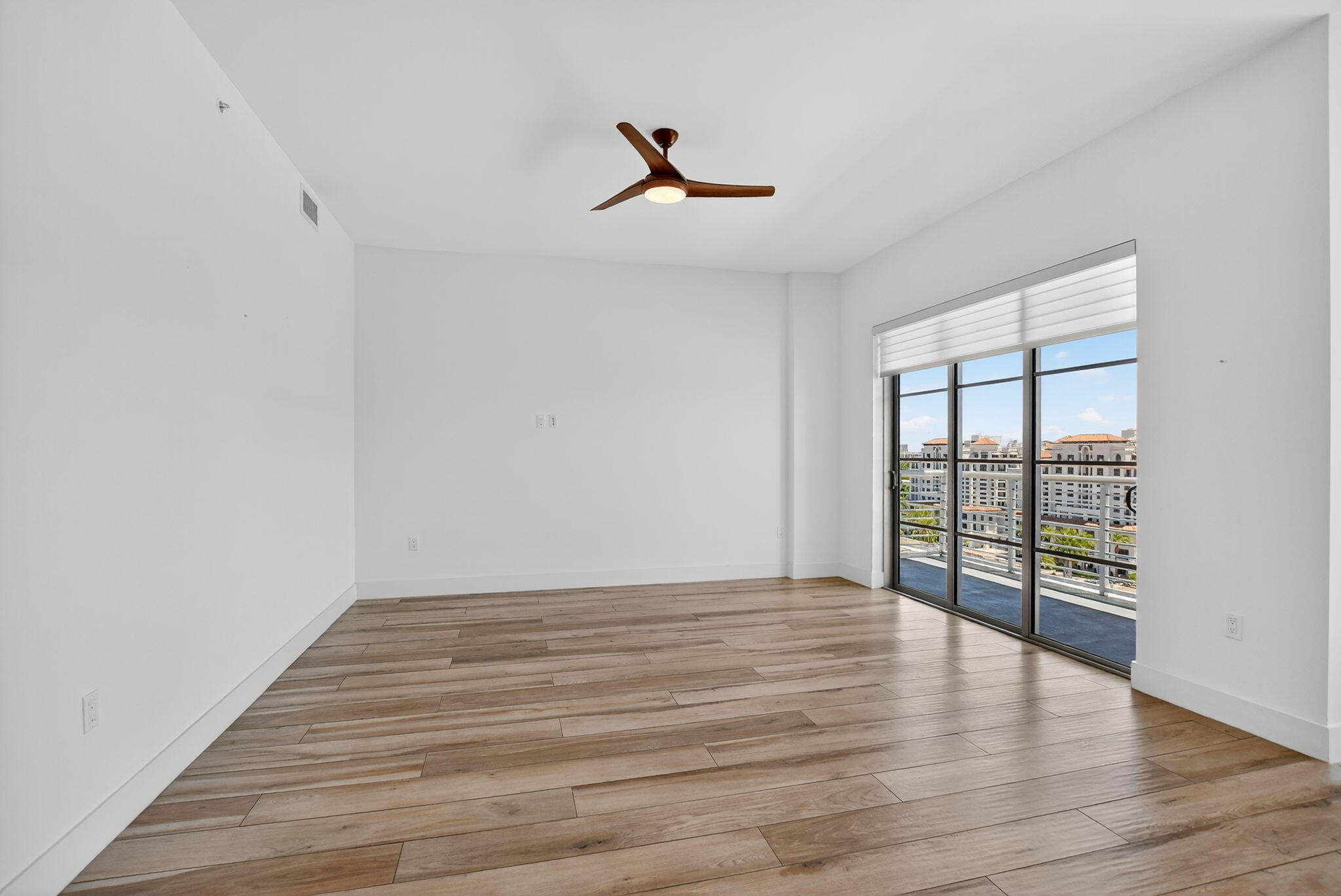 155 East Boca Raton Road, Unit 1014 Boca Raton, FL 33432 - Photo 26 of 62 wooden floor in an empty room with a window