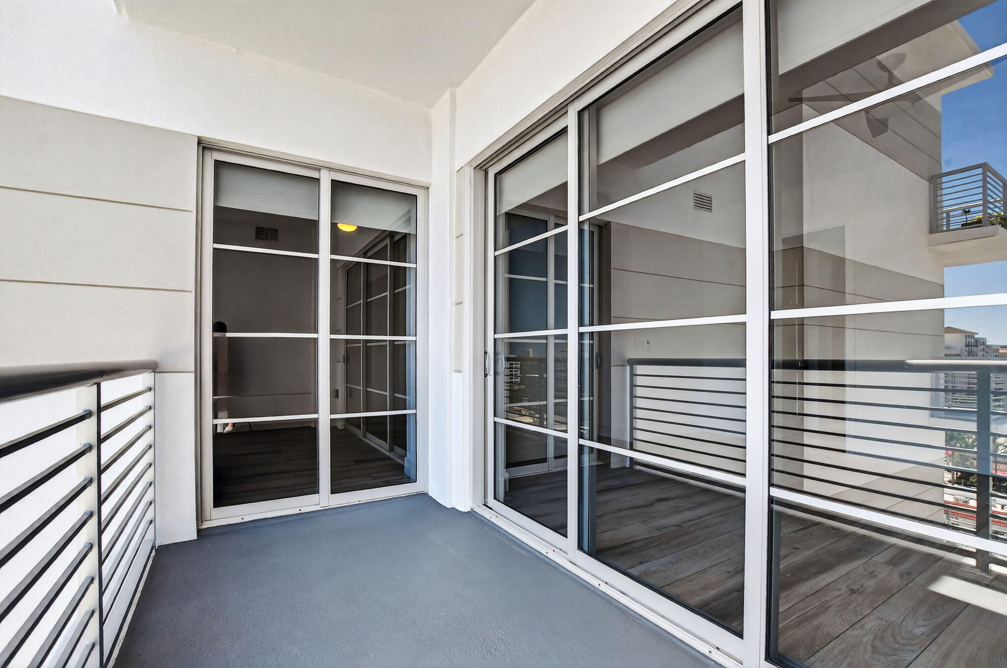 155 East Boca Raton Road, Unit 1014 Boca Raton, FL 33432 - Photo 27 of 62 a view of an empty room with wooden floor and a window